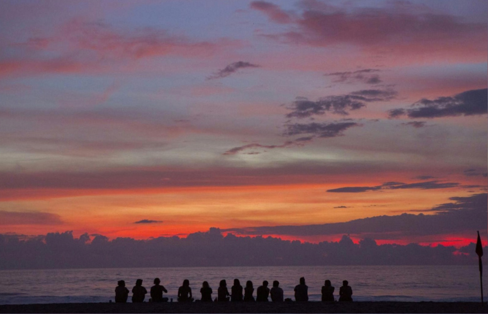 Advanced yoga session with instructor guiding students through breathing techniques