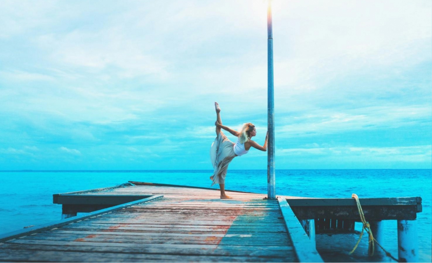 Yoga instructor demonstrating advanced technique in an online session